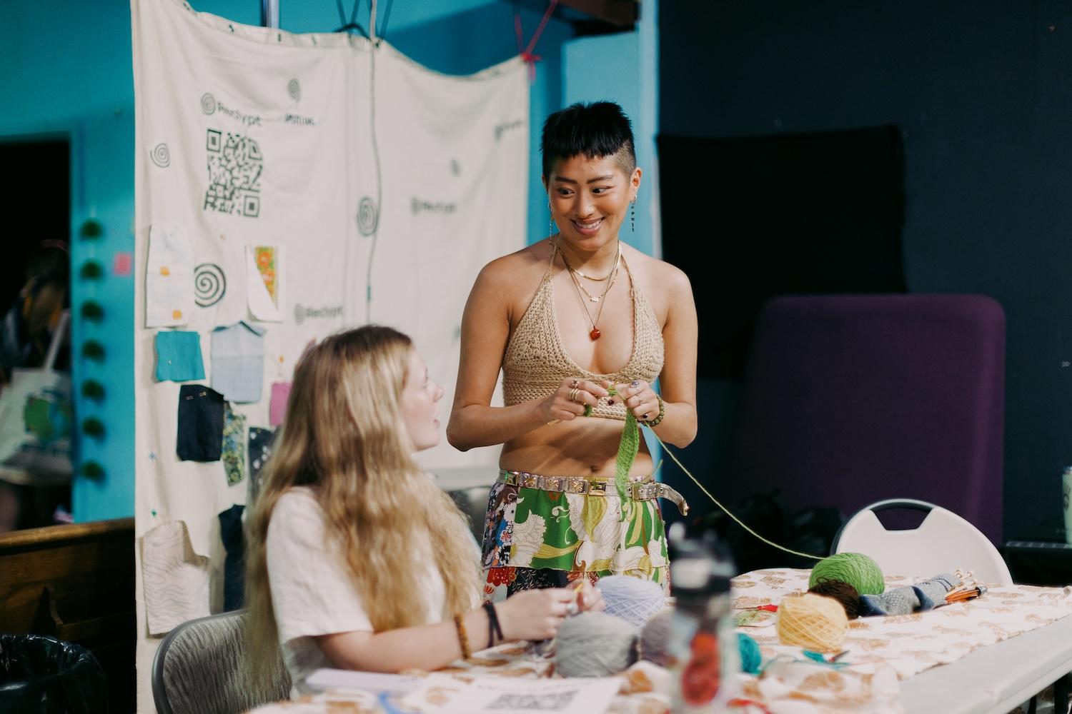 young people repair clothes at a sideline event during climate week 2023 - storytelling for climate justice